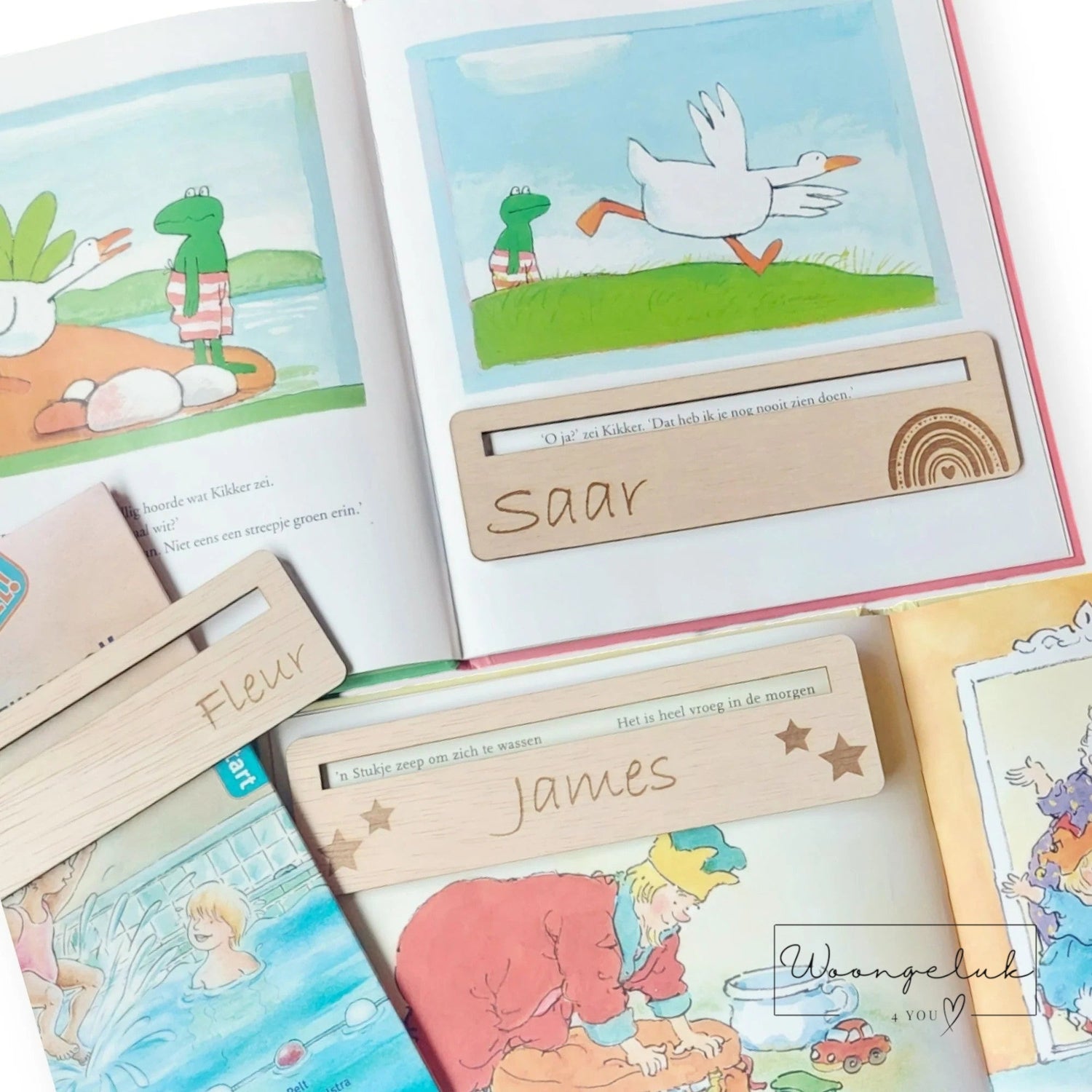 verschillende boekjes met daarop een leeswijzer gepersonaliseerd met naam en leuke illustratie