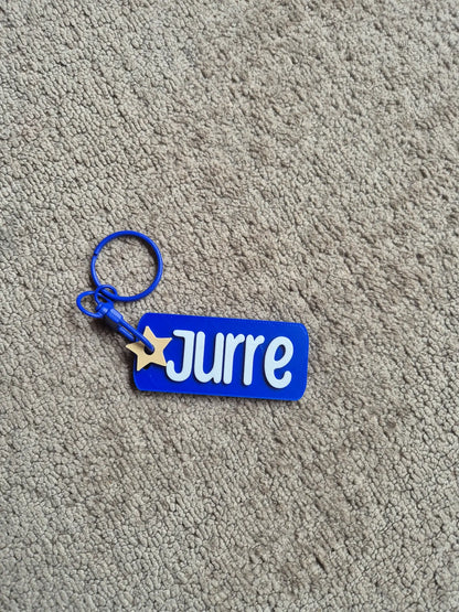 Sleutelhanger met naam Jurre en kleur blauw. 
