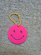 Sleutelhanger bliksem smiley 3D roze geel