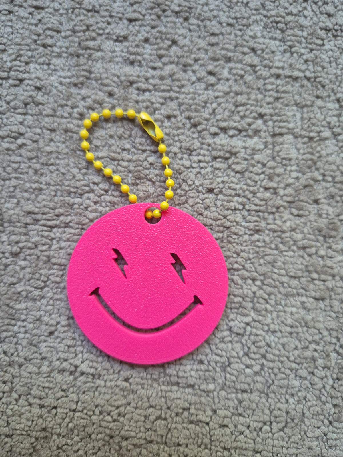 Sleutelhanger bliksem smiley 3D roze geel