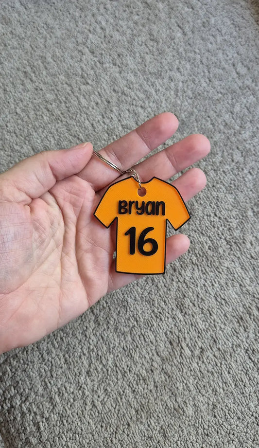 Sleutelhanger oranje in de hand gepersonaliseerd met eigen naam