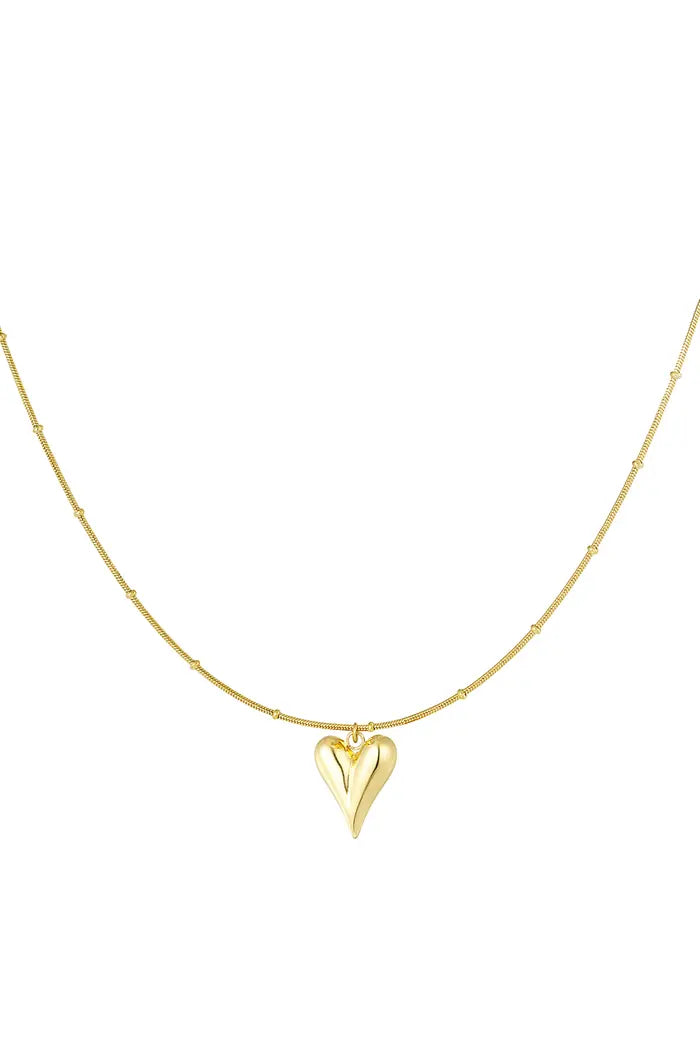 Goudkleurige bolletjes ketting met iconisch hart, gemaakt van stainless steel, duurzaam en stijlvol.