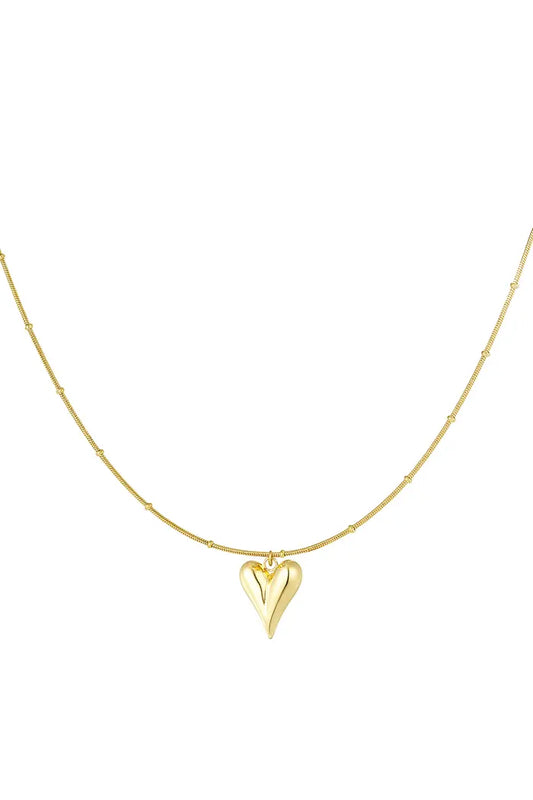 Goudkleurige bolletjes ketting met iconisch hart, gemaakt van stainless steel, duurzaam en stijlvol.