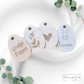 Set van 4 houten paaseieren, waarvan 1 gepersonaliseerd, ideaal voor paasdecoratie.
